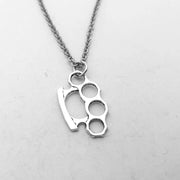 Punk brass knuckle pendant necklace with silver-tone finish, perfect for streetwear and alternative fashion lovers.